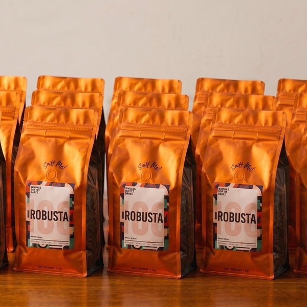 Row of sealed orange coffee bags from a Philippine wholesale coffee supplier